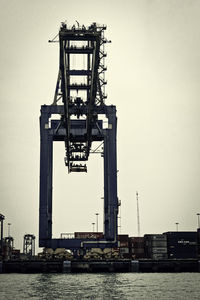 Lifeguard hut in river against clear sky