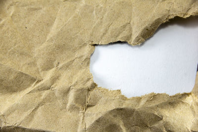 Close-up of hole on rock against wall