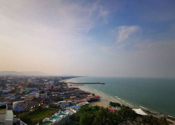High angle view of sea and buildings against sky