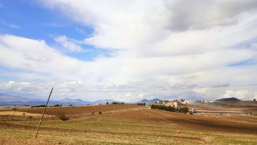 Scenic view of field against sky