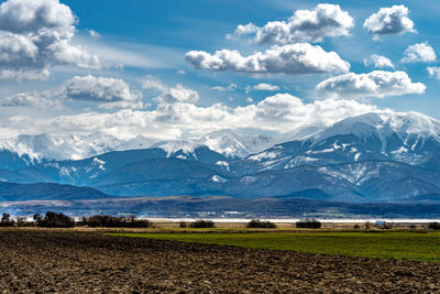 Scenic view of snowcapped mountains against sky