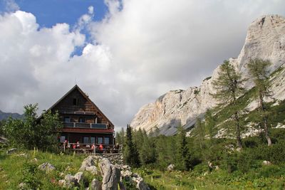 Scenic view of mountains against cloudy sky