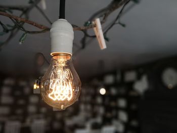 Low angle view of illuminated light bulb