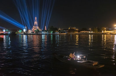 Illuminated city at waterfront