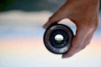 Close-up of hand holding camera