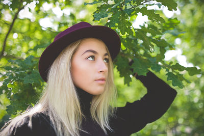 Portrait of young woman in forest