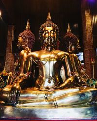 Buddha statue in temple outside building