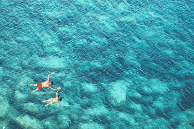 High angle view of couple snorkeling