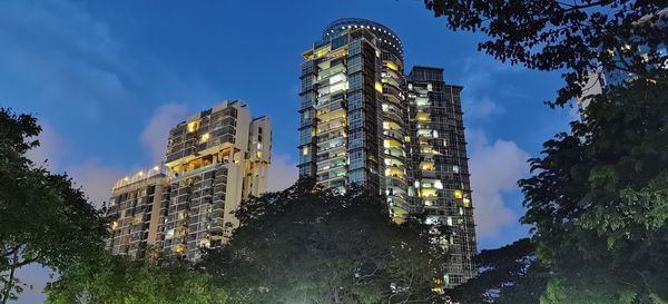 Low angle view of illuminated building against sky