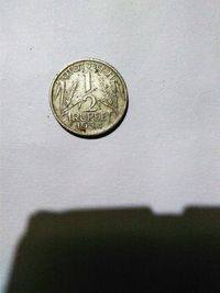 Close-up of coins on table