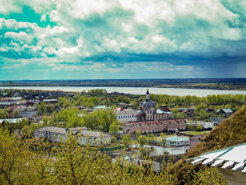 High angle view of houses against cloudy sky