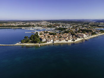 Aerial view of novigrad town facing the adriatic sea in istria, croatia.