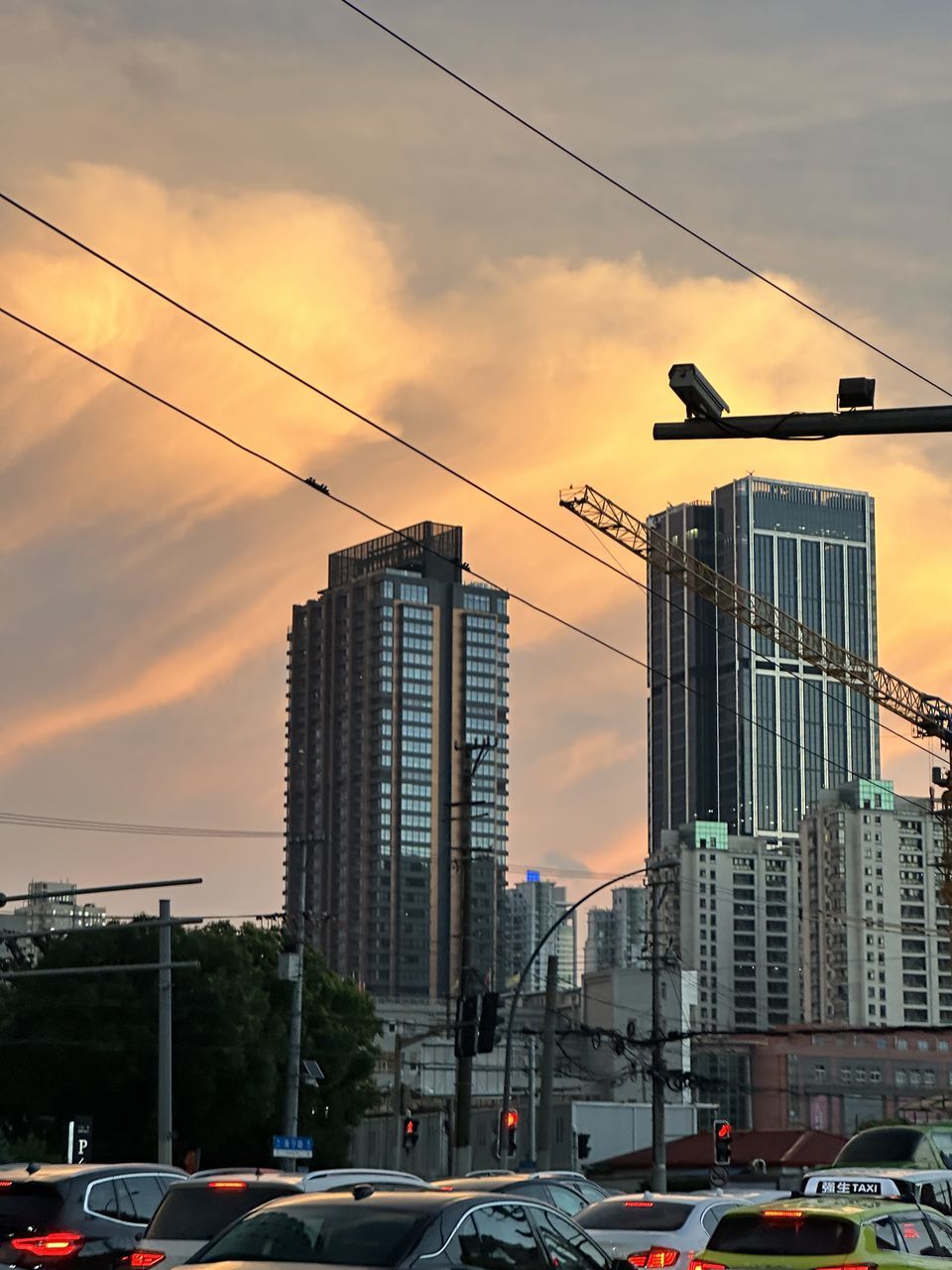 architecture, sky, built structure, city, building exterior, cloud, urban area, electricity, nature, low angle view, skyscraper, building, cable, construction industry, no people, outdoors, transportation, sunset, cityscape, sign, industry, business finance and industry, business