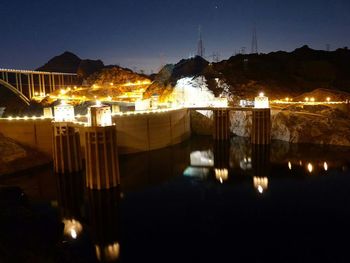 Reflection of illuminated lights in puddle