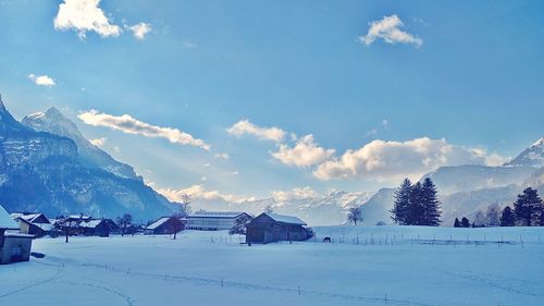 Scenic view of snow covered mountains