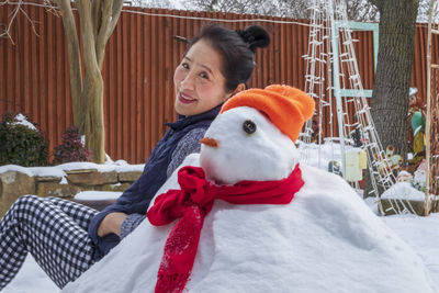 Portrait of smiling woman in snow