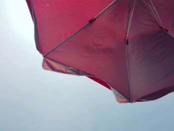 Low angle view of umbrella against sky