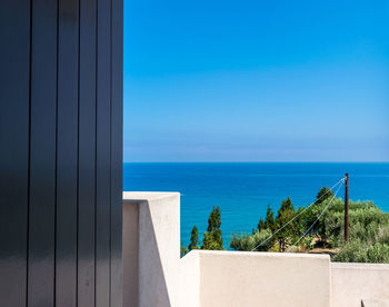 Scenic view of sea against clear blue sky