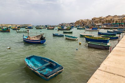 High angle view of sailboats moored in harbor