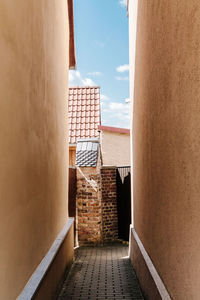 Steps leading towards sea against sky