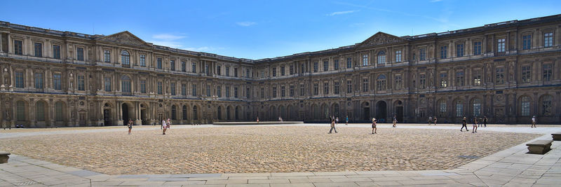 Cour carree in louvre museum during summer