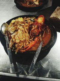 High angle view of meat in plate on table