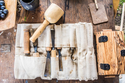 Directly above shot of hand tools on wooden table