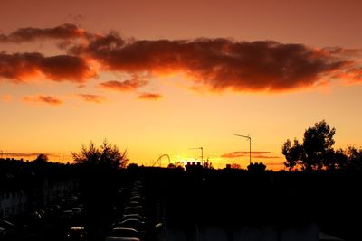 Silhouette trees against sky during sunset