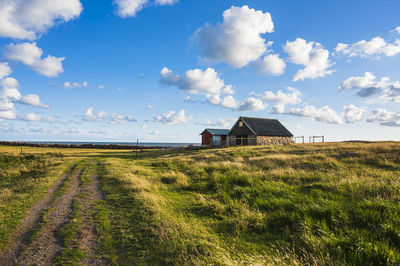 House on field against sky