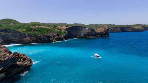 Scenic view of sea against clear blue sky