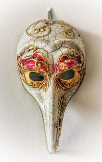 Close-up of decoration on table against wall