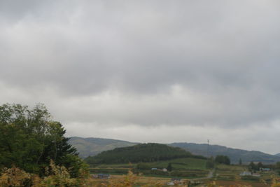 Scenic view of landscape and mountains against sky