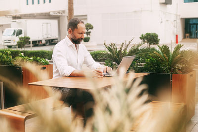Young man working at table