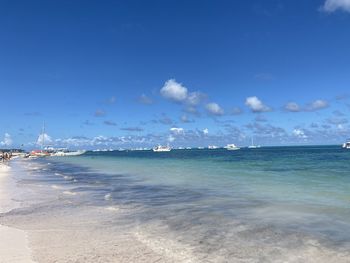 Scenic view of sea against blue sky