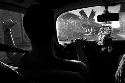 Man sitting in car