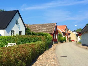 Empty road along houses