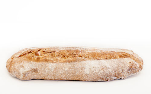 Close-up of cake against white background