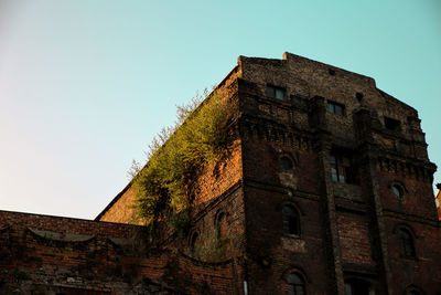 Low angle view of old building against sky