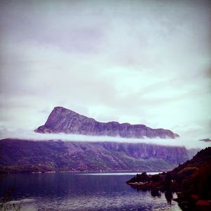 Scenic view of mountain against cloudy sky