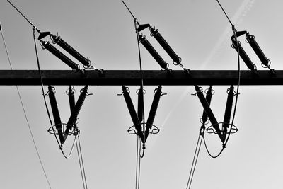 Low angle view of crane against clear sky