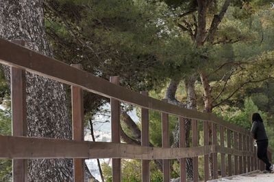 Man standing by railing