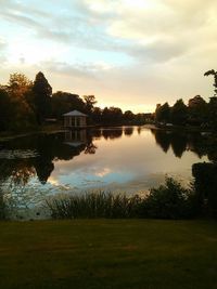 Scenic view of calm lake at sunset