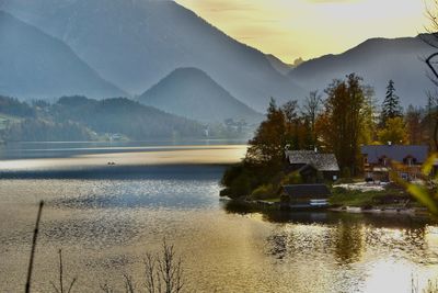 Scenic view of lake against sky during sunset