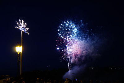 Firework display at night