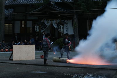 People in front of traditional building