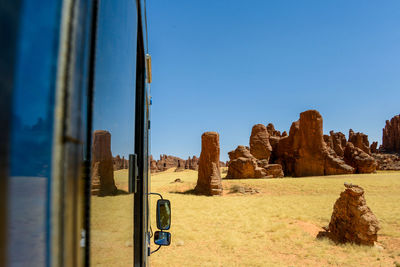 Panoramic view of landscape against clear blue sky