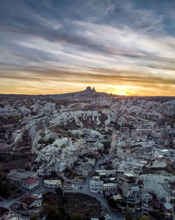 Aerial view of landscape against cloudy sky