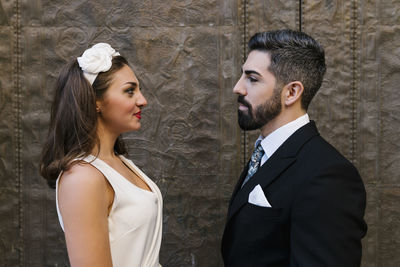 Portrait of a young couple standing outdoors