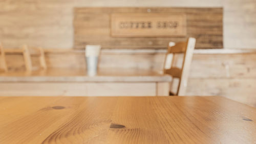 Empty chairs and table on hardwood floor