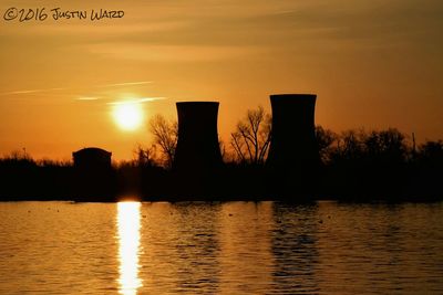 Scenic view of river at sunset